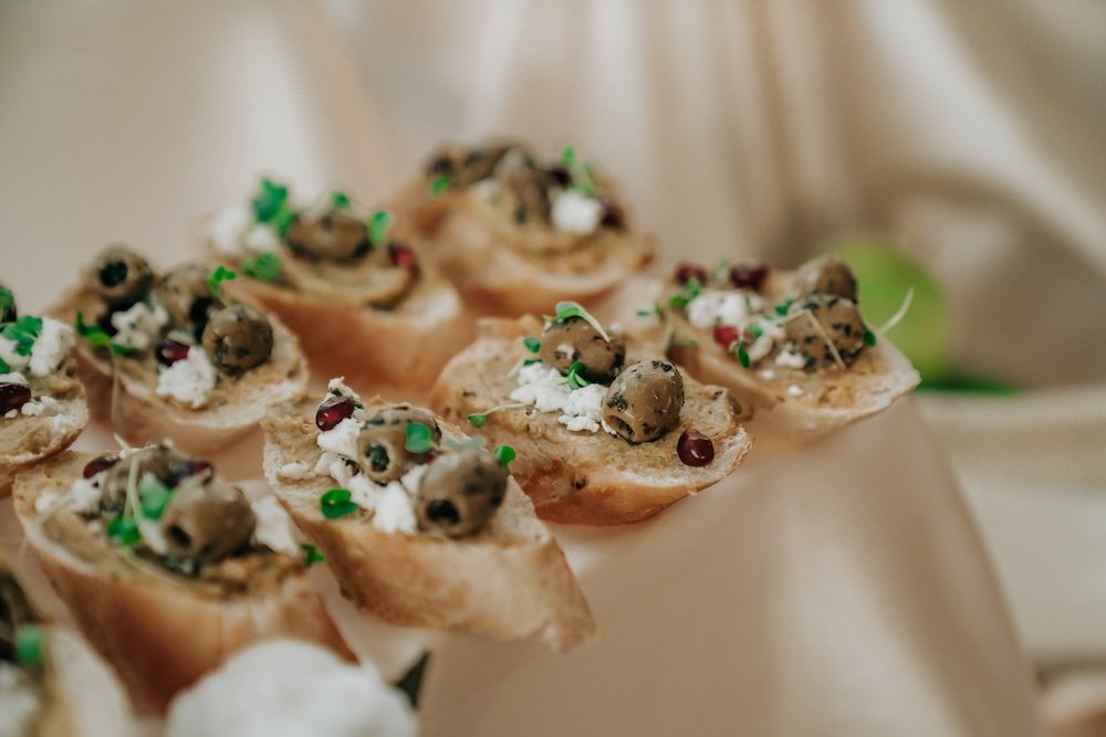 table display of grapes and food and flowers