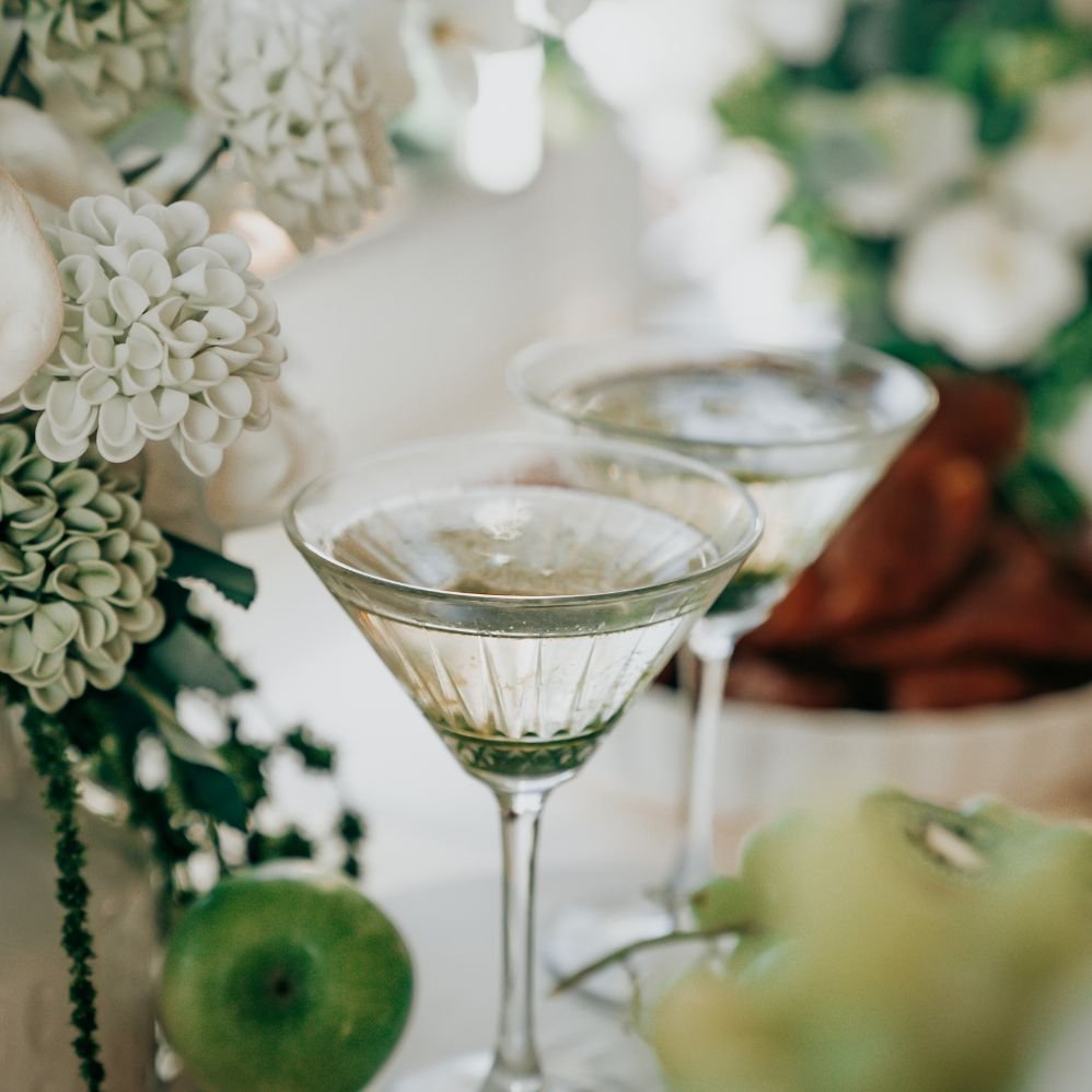 two glasses and flowers displayed